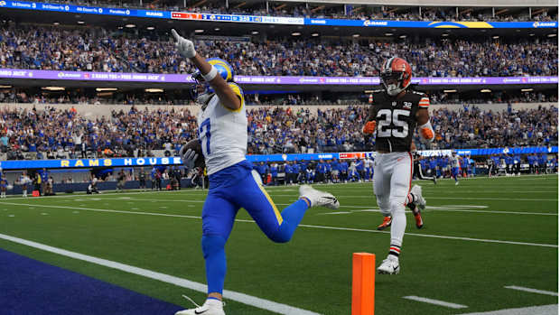 Los Angeles Rams wide receiver Puka Nacua (17) scores on a 70-yard touchdown reception against Cleveland Browns cornerback Kahlef Hailassie (25) in the first half at SoFi Stadium.